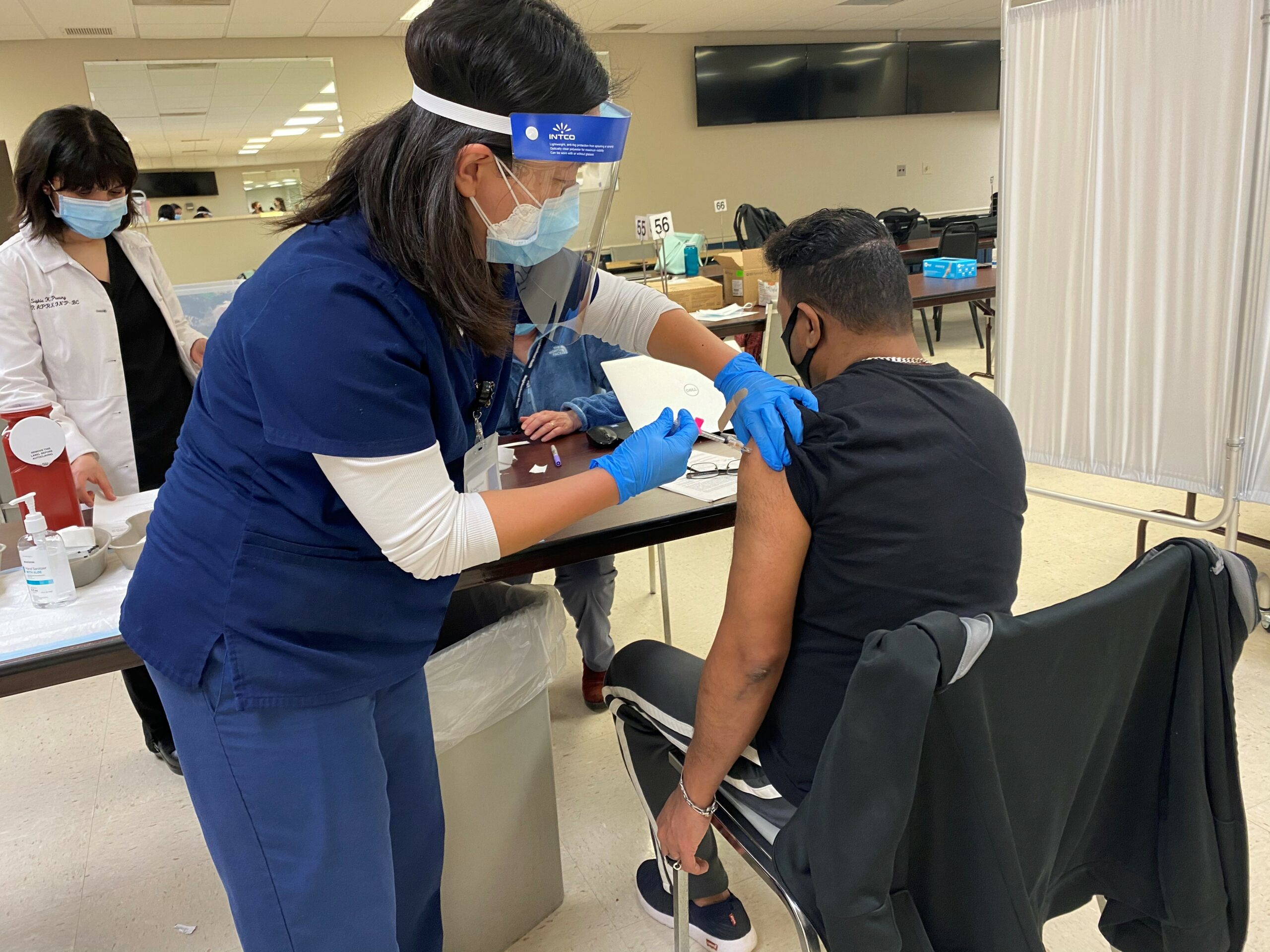 vaccine clinic nurse and patient