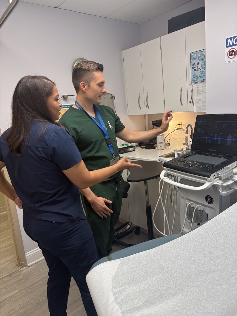 Dr and Nurse looking at ultrasound machine